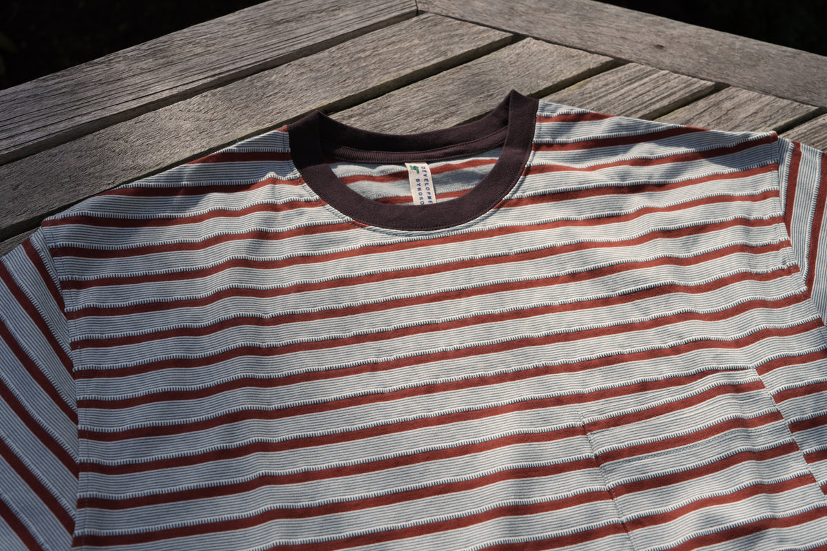 UNEVENNESS S/S TEE/ORANGE – DEVELOPMENT BY NOROLL