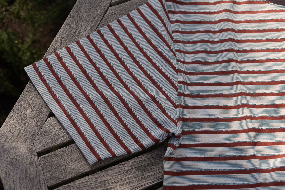 UNEVENNESS S/S TEE/ORANGE – DEVELOPMENT BY NOROLL